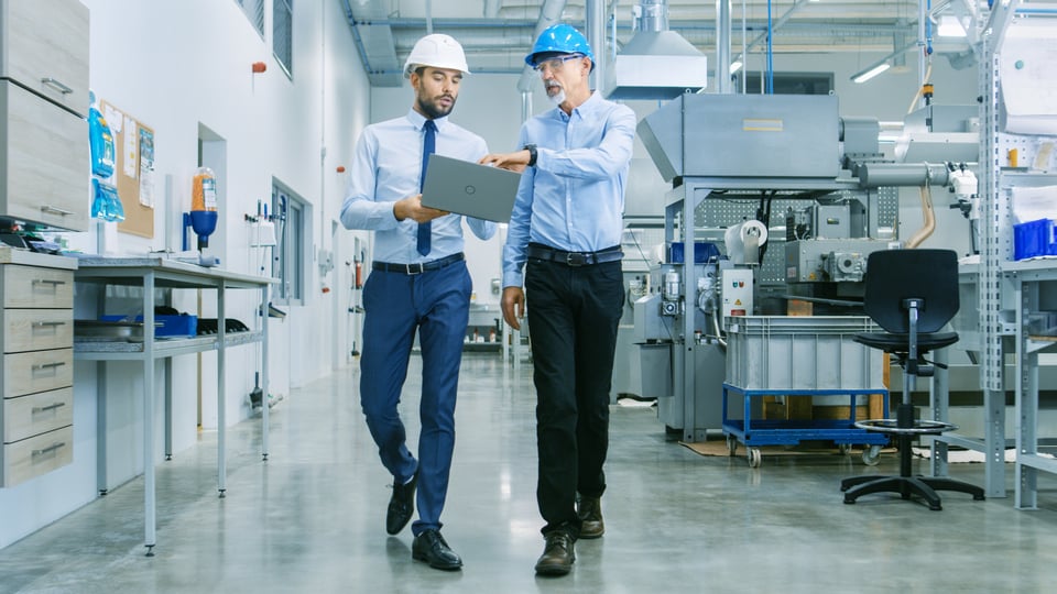 iStock-two men walking facility